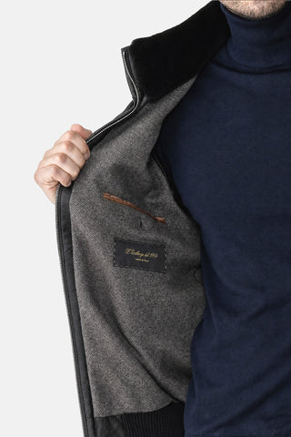 Bomber in pelle con collo di pelliccia